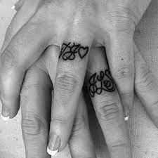 Small Cursive Initials On The Front Of Fingers Looks Like A Ring That S Drawn Onto The Skin It Tattoo Wedding Rings Him And Her Tattoos Wedding Band Tattoo