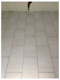 It is impossible to really judge how things will look in the kitchen because obviously the cabinets and trim are not painted yet and there are dozens of little things still left to do. Is This Grout Too Dark For White Kitchen Tiles
