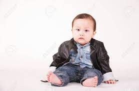 Portrait Of Baby Boy In Leather Jacket White Background Stock Photo Picture And Royalty Free Image Image 69867137