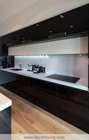 Sometimes forgoing color for a classic palette can really pay off, and these black and white kitchens from top designers are proof. Modern Black And White Kitchen With Led Light Cornice Below Cupboards Modern Kitchen Remodel Contemporary Kitchen Design Kitchen Room Design