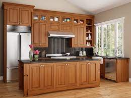 Alder kitchen cabinets with gentle wood tones surrounding the soft coloration of the cooking center is pleasing to the eye. Alder Rustic Alder Canyon Creek Cabinet Company