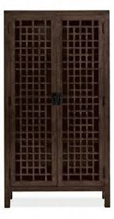 A dart board cabinet can be a great addition to your games room, or pretty much any other room of your home. Zen Tall Cabinet Cabinets Armoires Living Spaces Room Board