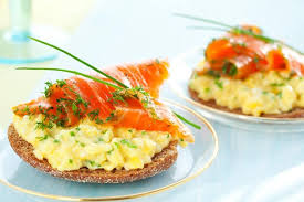 An indulgent breakfast sandwich made with a toasted, flaky croissant, smoked salmon, eggs, chives, avocados and havarti cheese. Breakfast Ideas With Eggs Scrambled Eggs With Smoked Salmon Healthy Salmon Recipes Food Fresh Salmon Recipes