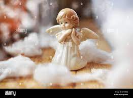 cute little angel in the sky with white clouds Stock Photo - Alamy