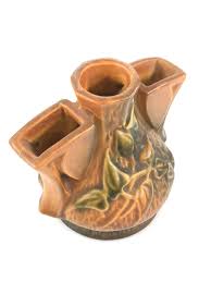 Roseville pottery has a long history as a collectible and as a favorite with decorators. Lot Roseville Pottery 50 Clematis Pattern Flower Frog