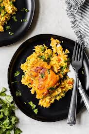 Arroz con pollo, or chicken cooked with rice, is a common dish in spain, latin america and the caribbean. Arroz Con Pollo Lightened Up Latin Chicken And Rice