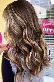 If you have dark brown hair, lighten it with some caramel blonde highlights. Beachy Highlights That Make Every Hair Color Look Perfectly Sunkissed Hair Styles Hair Highlights Brown Hair With Blonde Highlights