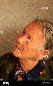 97 year old Vietnamese woman working her stall in a Mekong Delta wet  market, Vietnam Stock Photo