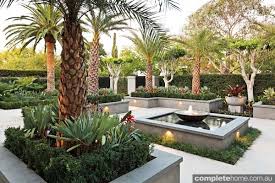 Formal Meets Tropical In This Landscape Design From Franklin Landscape Tropical Landscape Design Tropical Landscaping Landscape Design