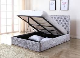 The tall velvety headboard with vertical tufted channels conceals the plush foam tucked inside, ready to help you get through just one more chapter. Yasmin Silver Crushed Velvet Double Storage Bed Double Bed Frames Furn On