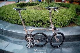 custom chrome brompton found here everything here seems customized including a fork stem with welded bottle cage mounts and a brompton bicycle brompton bike