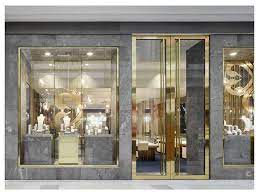 Open front kimono with an embroidered paisley design, tassels and some light mesh on the bott. Jewellery Shop Design Exterior Jewelleryshopdesignexterior Marble And Brass Shop Front E In 2021 Jewellery Shop Design Jewelry Store Design Jewelry Store Interior