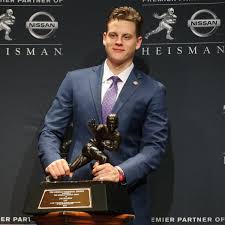 Figure skating champion and olympic gold medalist kristi yamaguchi will be awarded the 14th annual heisman humanitarian award in. Lsu Quarterback Joe Burrow Wins Heisman Trophy In Landslide Vote College Football The Guardian