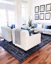 Living Room Decor With Blue Vintage Distressed Rug Modern Furniture Large Windows And French Doors Home Living Room Living Room Inspiration Home And Living