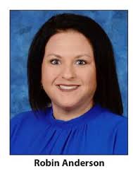 Miss Charles M. Irvine, a dedicated educator and lifelong advocate for  learning. A 1913 graduate of Richmond High, Miss Irvine pursued her passion  for education by earning her teacher certification from Knoxville