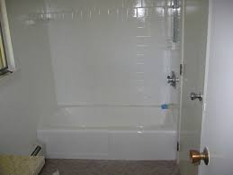 Bathtub refinishing involves sanding down the tub's surface, filling in cracks and applying several coats of primer before rebuffing. Bathtub Reglazing Abington Ma New Look Refinishing