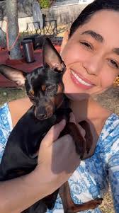 person enjoys playing in sunny yard