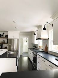 Modern Farmhouse Kitchen White Cabinets With Black Countertops Black Hardwa White Cabinets Black Countertops Diy Kitchen Countertops Modern Kitchen Cabinets