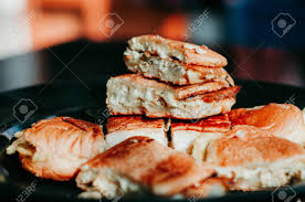 Close Up Of Malaysian Well Known Food "Roti John" On A Dark Background.  John Bread Or "Roti John" Made Of Eggs, Minced Meat And Bread, Served With  Melted Cheese. Popular During Ramadan.