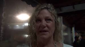 Nancy Schultz Vitangeli accepting Dave Schultz UWW Hall of Fame honor