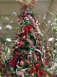 Red Green And White Whimsical Christmas Tree Designed By Arcadia Floral And Home Decor Whimsical Christmas Trees Cool Christmas Trees Whimsical Christmas