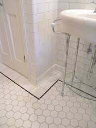 The stunning space features intricately designed wallpaper, an ornate wood vanity and a mosaic tile floor. Images Of Classic Bathroom Tile Sample Photos Of Vintage Bathroom Tile Vintage Bathroom Tile Classic Bathroom Tile Patterned Bathroom Tiles