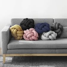 Metallics often complete any color palette, adding a chic touch of glamour to the overall look. The Knot Cushions Design House Stockholm Knot Cushion 50 Wool 50 Acrylic Filling 100 Polyester Light Grey