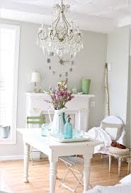 A shabby chic meets rustic white dining room with elegant vintage furniture, an old chandelier and potted plants and blooms. Shabby Chic Dining Room Decorating 5 Decorecent