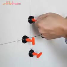 This Makes Laying Tiles Easier Easier Laying Tiles How To Lay Tile Tile Leveling System Diy Bathroom Remodel