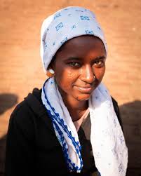 Veiled in amber light, she stands with quiet strength—every wrinkle, a  verse of survival, every glance, a chapter of grace. : r/varanasi