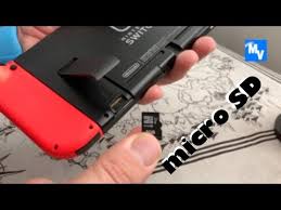 Ensure the microsd card is properly positioned with the label facing away from the console. How To Put In A Micro Sd Card In Your Switch Youtube