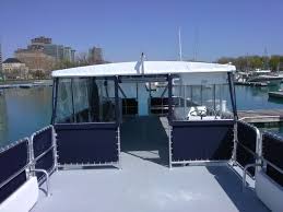 Look for our rentchicaoboats.com sign on gray dock. The Big Boat 36 Passengers Chicago Sailboat Charters