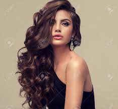The beachy look in this long hairstyle comes somewhere between classic waves and messy hair. Young Woman Brunette With Voluminous Shiny And Wavy Hair Beautiful Stock Photo Picture And Royalty Free Image Image 79582805