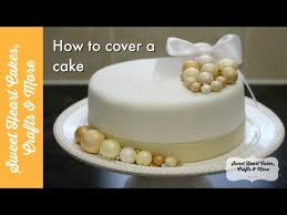 Next, fold the same piece of paper towel into a square and use it to smooth out the sides one section. Cover A Cake With Marzipan Fondant How To Decorate A Fruit Cake Tutorial Youtube