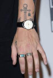 Helene pambrun/getty images the fine line singer has more than 40 tattoos, including a mermaid on his forearm. Harry Styles Tattoo Guide Harry Styles Tattoos Meanings Explained