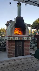 Next, push the fire to the back of the oven to clear a space for your pizza. Fire Brick Pizza Oven Build Diy