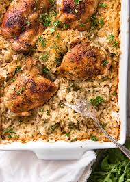 A One Pan Oven Baked Chicken And Rice Made Entirely In The Oven The Rice Is Outrageously Delicious From One Little Tric Recipes Chicken Recipes Baked Chicken