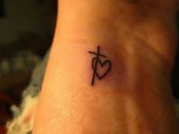 These top 69 small cross tattoo examples show that there is a versatile and interesting range of ways to depict the christian cross in small designs. Love The Heart Intertwined With The Cross Cross Heart Tattoos Tattoos Small Heart Tattoos