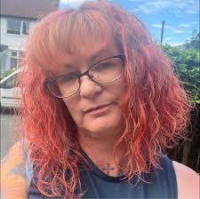 Back to styling the Jessie wig today! We covered this Eva foam shape in red  batting and then I glued layers of wefts around the whole thing. Now I have  to go