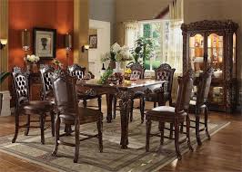 Some dining tables come with a storage pedestal base. Vendome Counter Height Dining Acme 62025