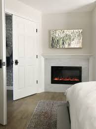 Its strong vertical lines give visual height to the room and provide a marked contrast to the accessories on top of the mantle. Our Samsung Frame Tv An Unsolicited Review Chris Loves Julia