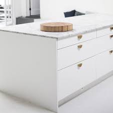 A Photography Studio Centered Around Food And Creativity Slab Door Slab Door Kitchen Minimalist Cabinet