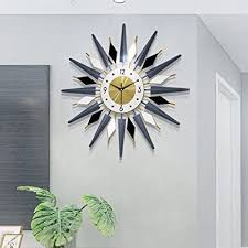 Made in 1949, just before the peak 1950s fascination with contemporary design, the sunburst provided an unusual diversion from traditional clock design.<p> shaped like a sun, its shape strayed away from traditional. Buy Jugv Large 27 6 Inch Metal Crystal Wall Clock Non Ticking Silent Quartz Mid Century Instruments Satellite Wall Clocks Starburst Wall Clocks For Living Room Kitchen Office Decor Online In Indonesia B08ptzf3q3