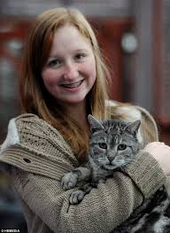 The curious cat is pictured with <b>Sarah Adie</b>, 14, who is looking after him in <b>...</b> - article-2465348-18CB32CC00000578-860_634x870