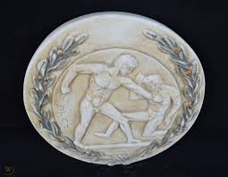In the panhellenic games of ancient greece, wrestling, boxing and pankration were called the heavy events. the term was chosen to describe combative contests in those arts because they were not only crowd favorites but also the domain of the larger and heavier athlete. Olympic Games Boxing Athlete Sculpture Relief Wreath In Ancient Greece 1737103983