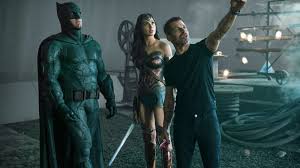 Snyder can be seen wearing a mask and holding a camera in the photo. Eivsh5t7 0hpqm