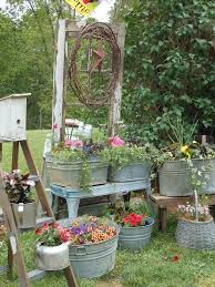 If You Are Thinking Of Giving Your Garden A Vintage Appeal Then Get The Rusty Buckets From The Attic And Pl Bucket Gardening Spring Garden Vintage Garden Decor