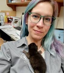 Dr. Emily Thomas, a veterinarian, and her dog
