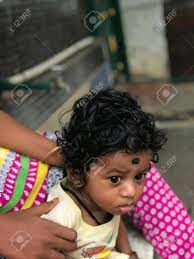 Indian Baby Boy With Black Curling Hair With His Baby Sitter Stock Photo Picture And Royalty Free Image Image 156055130