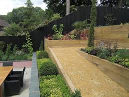 Contemporary Sloping Garden Design In Gerrards Cross Buckinghamshire With Rendered Blockwork Retaining Walls Ram Sloped Garden Garden Design Landscape Design